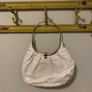 Pale pink pleated metallic purse